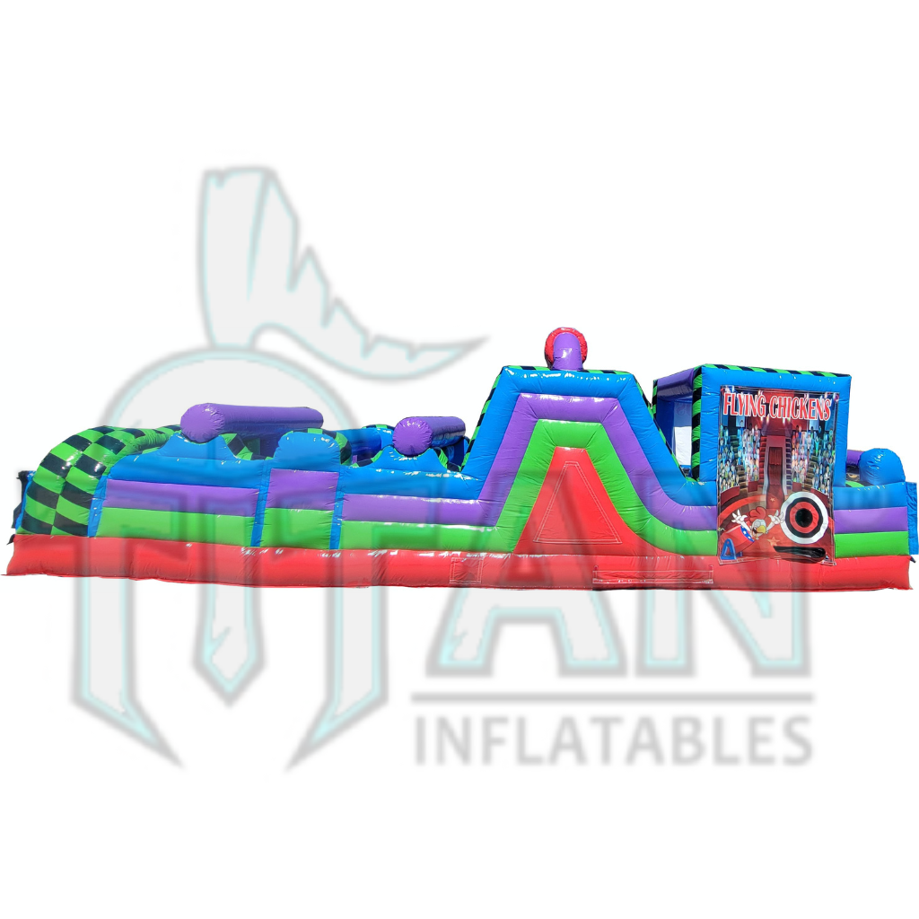 Right facing view of Titan inflatables multi colored 35 foot conqueror inflatable  obstacle course with the 30 foot conqueror inflatable rock climb slide